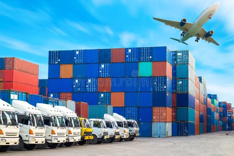 Containers, trucks and a plane at a logistics hub