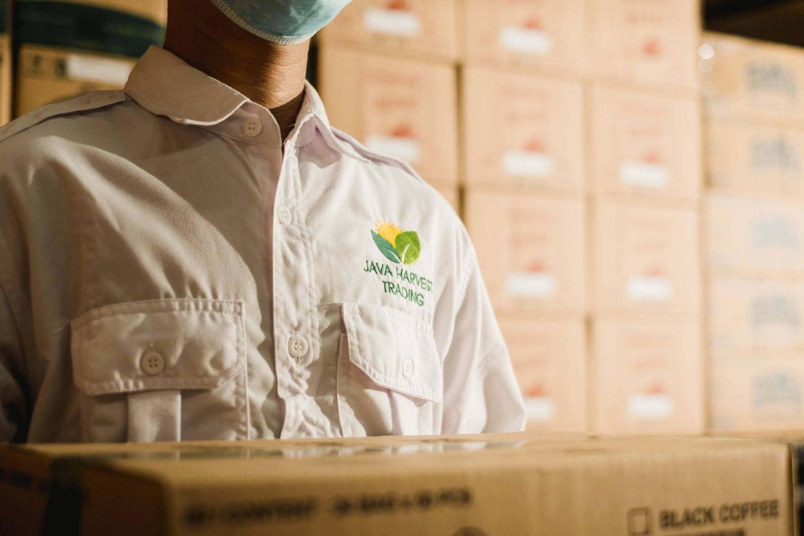 Java Harvest Trading logo embroidered on a staff uniform